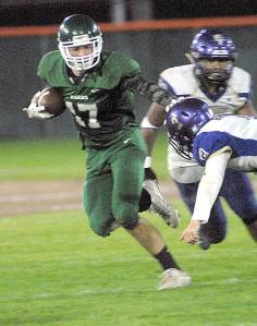 <strong>Keith Thorpe</strong>/Peninsula Daily News                                Port Angeles Garrett Edwards, left, fends off the defense of North Kitsaps Colton Bower during last weeks game at Civic Field.