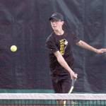 Mark Krulish/Kitsap News Group Sequims Damon Little returns a shot during a West Central District Tournament doubles match at Kitsap Tennis and Athletic Center in Bremerton. Little and partner Liam Payne finished third and qualified for the state tournament in May.