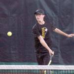 <strong>Mark Krulish</strong>/Kitsap News Group                                Sequims Damon Little returns a shot during a West Central District Tournament doubles match at Kitsap Tennis and Athletic Center in Bremerton. Little and partner Liam Payne finished third and qualified for the state tournament in May.
