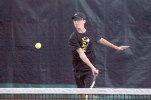<strong>Mark Krulish</strong>/Kitsap News Group                                Sequims Damon Little returns a shot during a West Central District Tournament doubles match at Kitsap Tennis and Athletic Center in Bremerton. Little and partner Liam Payne finished third and qualified for the state tournament in May.