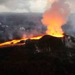 In this July 14 photo provided by the U.S. Geological Survey, lava from the Kilauea volcano erupts in the Leilani Estates neighborhood near Pahoa, Hawaii. (U.S. Geological Survey via AP)