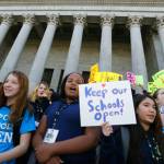 Children hold signs during a rally in support of charter schools at the Capitol in Olympia on Feb. 25, 2016. (Ted S. Warren/The Associated Press)