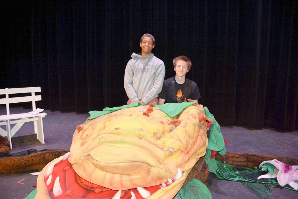 Two of the student puppeteers who operate the Audrey Two plant puppet are Xavion Mason (left) and Ryon Miller.