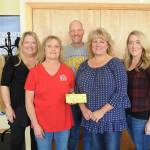Joining Coats for Kids program representatives are, front row from left, Heidi Albrecht and Karen Lewis and back row from left, Shelley Langston, Learning Support Services executive director; Sequim School District psychologist Matt Duchow, and Special Programs coordinator Renee Alcafaras. (Michael Dashiell /Olympic Peninsula News Group)