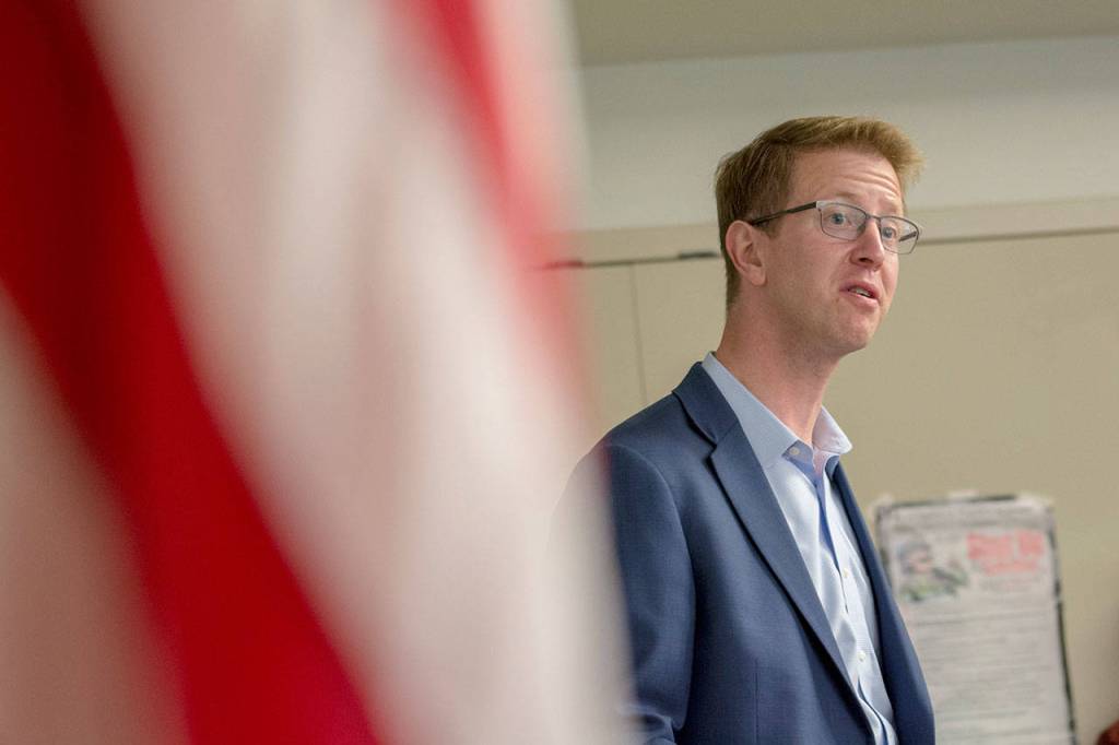 U.S. Rep. Derek Kilmer thanks Vietnam War era veterans during a pinning ceremony in Port Ludlow Thursday evening. (Jesse Major/Peninsula Daily News)