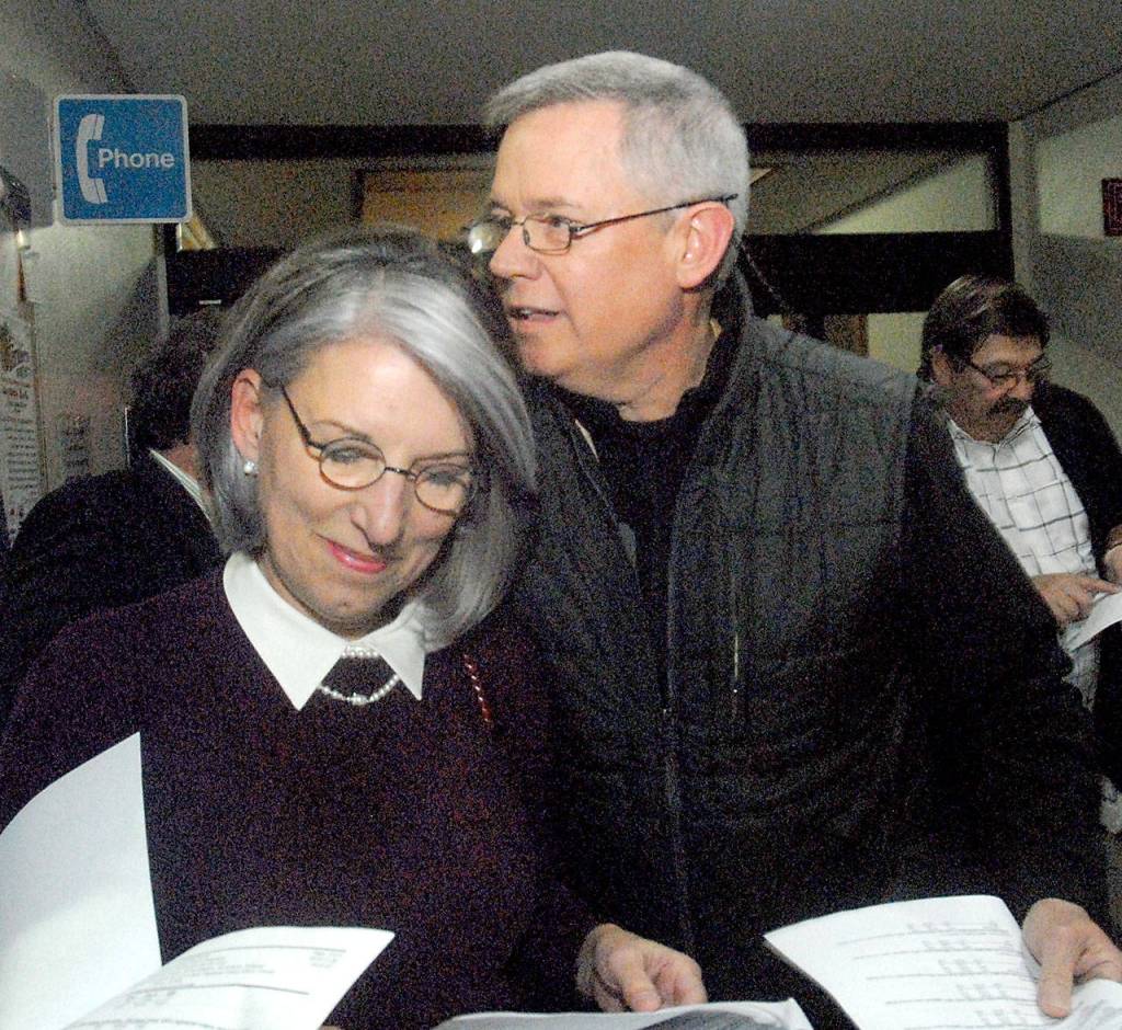 Clallam County Director of Community Development Mary Ellen Winborn, left, looks at election returns with her husband, Clallam County Parks, Fair and Facilities director Joel Winborn. (Keith Thorpe/Peninsula Daily News)