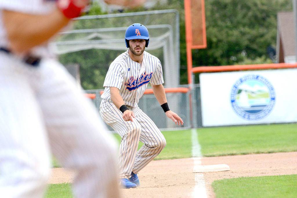 Port Angeles Lefties catcher Ronnie Rust eyes home plate before scoring in the second inning against the Yakima Valley Pippins during a game in July. Rust is returning to the Lefties next season.                                (Jesse Major/Peninsula Daily News)