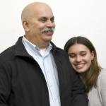 Jefferson County Sheriff-elect Joe Nole and his daughter learn of his election over incumbent Sheriff David Stanko on Tuesday night at the Jefferson County Courthouse. (Jeannie McMacken/Peninsula Daily News)