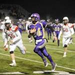 Michael Dashiell/Olympic Peninsula News Group Sequim quarterback Riley Cowan runs for a first down in the opening quarter of the Wolves 49-12 Class 2A state tournament loss to Steilacoom on Friday.