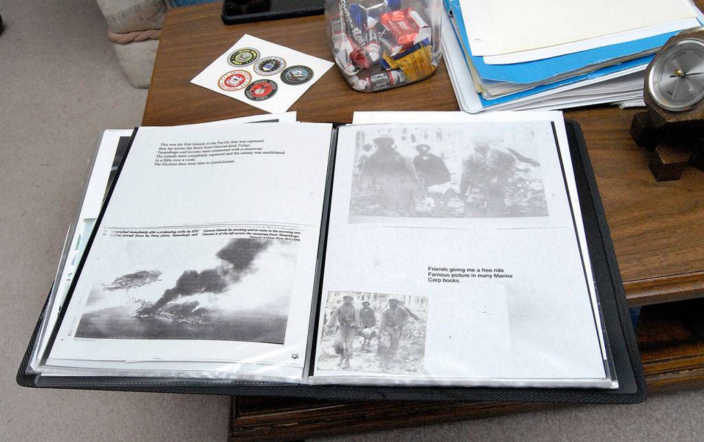 A scrapbook of photos and newspaper articles about Tom McKeown Sr., sits on the coffee table in McKeowns Port Angeles home. (Keith Thorpe/Peninsula Daily News)