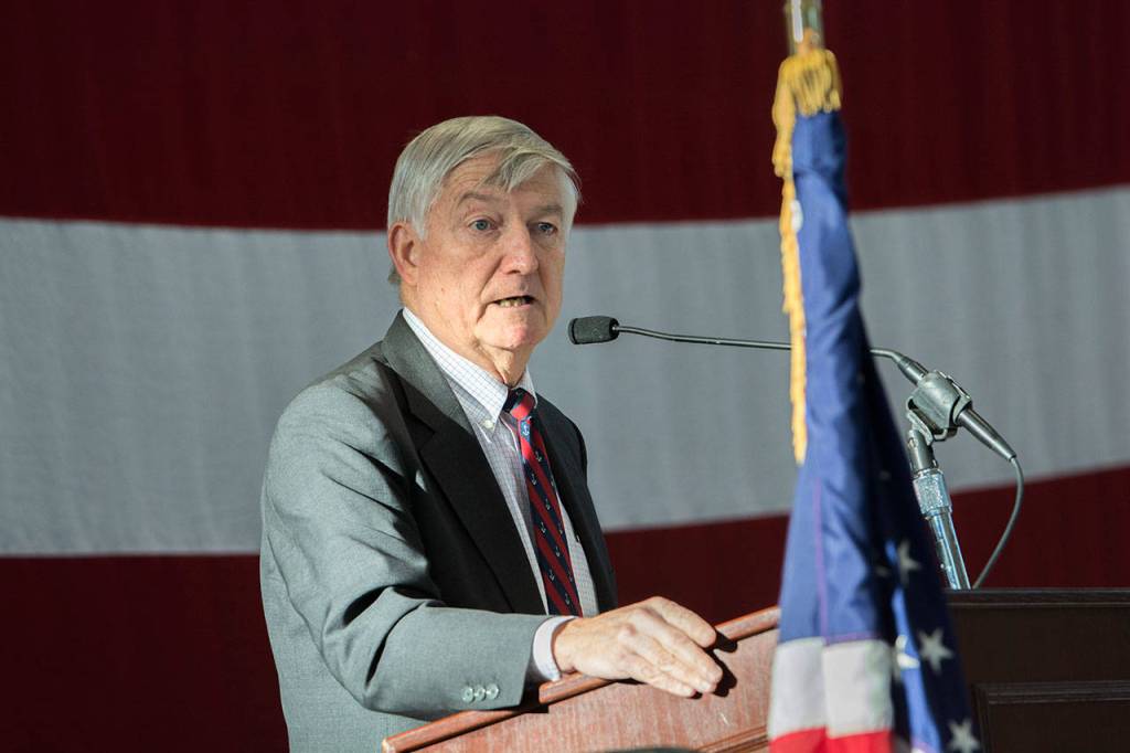 Retired Navy Rear Adm. James Kelly tells veterans they need to take care of themselves during the Veterans Day ceremony at U.S. Coast Guard Air Station/Sector Field Office Port Angeles on Sunday. (Jesse Major/Peninsula Daily News)