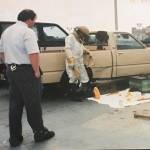 Buddy DePew watches as a beekeeper safely removes honey bees from his truck 30 years ago from a parking garage in Seattle. DePew said the incident may have helped lead to his interest in beekeeping.