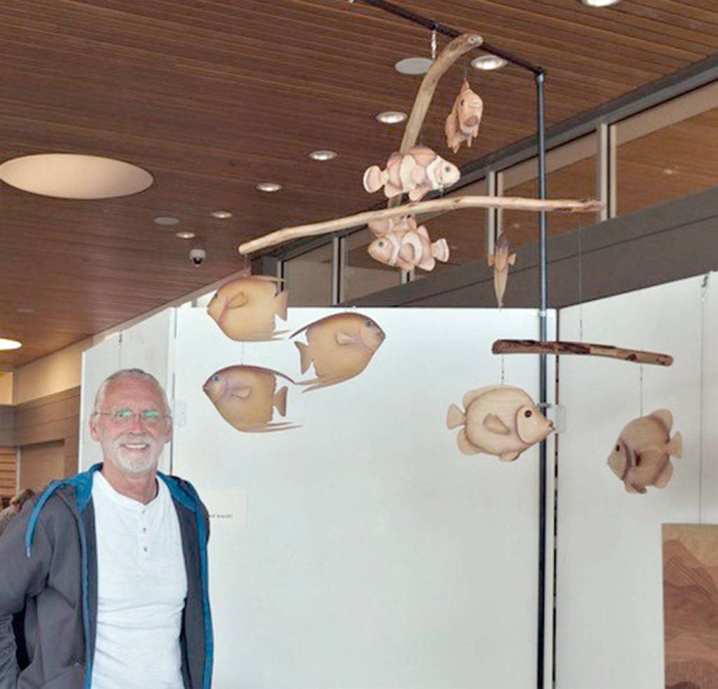 David Johannessohn shows his fish mobile.