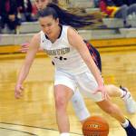 Keith Thorpe/Peninsula Daily News Peninsulas Ashlynn Sharp, front, drives past Lower Columbias Shanay Dotson in Port Angeles in January last season. Sharp is the only player from last years active roster back on the Pirates this year and looks to get more scoring help from her teammates than last year.