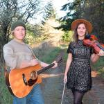 Will Jevne, left, and Chandra Johnson grew up playing the fiddle together in the Sequim and Port Angeles areas.