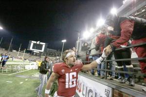 The Associated Press                                Washington State quarterback Gardner Minshew celebrates with fans after throwing seven touchdown passes in a 69-28 win over Arizona last Saturday.
