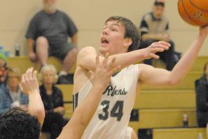 BOYS BASKETBALL: No ceiling for tall, experienced Roughriders