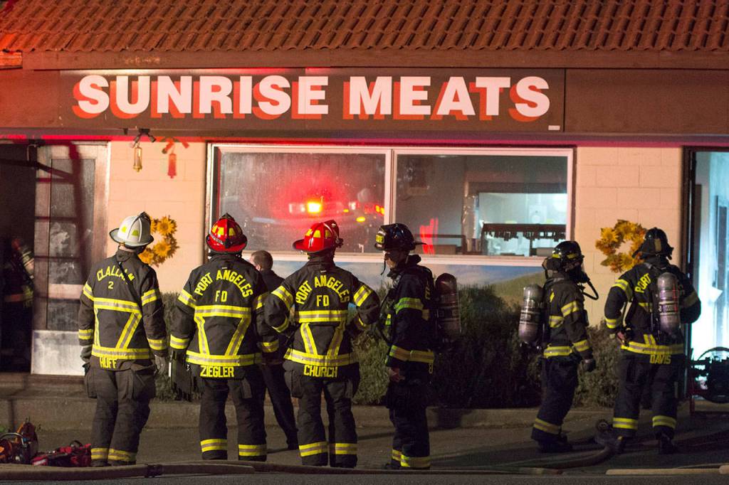 Firefighters from the Port Angeles Fire Department and Clallam Fire District No. 2 responded to a fire at Sunrise Meats late Saturday night. (Jesse Major/Peninsula Daily News)
