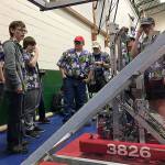 Sequim Robotics Federation team members gather for a weigh-in of their robot last year in Yakima. This year, the team hosts a fundraiser Saturday at Sequim High School with a luau and auctions.