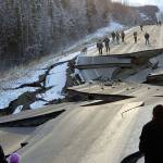 People walk along Vine Road after an earthquake Friday in Wasilla, Alaska. (Jonathan M. Lettow via AP)