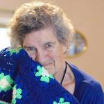 (Diane Urbani de la Paz/for Peninsula Daily News)                                Marie Sewell of Port Townsend makes afghans  such as this one with Seahawks colors  to give away.