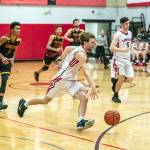 Steve Mullensky/for Peninsula Daily News Port Townsends Jaden Watkins drives for the basket and an easy lay-up after a steal during a game against Kingston on Friday at th ehigh school.
