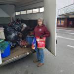In answer to a call from the Port Angeles Elks Club for horse items to donate to Californias fire victims, Valerie Jackson of the Olympic Peninsula Equine Network unloads items they were going to use for OPENs own fundraiser because we know what its like to be in need. (Diane Royall)