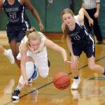 Keith Thorpe/Peninsula Daily News Port Angeles Summer Olsen, center, out races Cascade Christians Sarah Midimo, left, and Lexi Jay in the third quarter on Wednesday at Port Angeles High School.