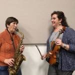 Debbi Soderstrom, left, and Beth Pratt, presidents of the boards of the Sequim City Band and the Sequim Community Orchestra, gear up for the Sundays holiday concert featuring both groups.