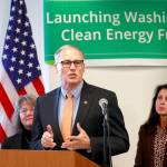 Gov. Jay Inslee speaks about tackling climate change during a press conference at Pacific Tower in Seattle on Monday. (Erika Schultz/The Seattle Times via AP)