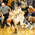 Michael Dashiell/Olympic Peninsula News Group Sequims Joey Oliver dribbles away from Forks Seth Johnson during the Wolves 72-70 win over the Spartans on Monday in Sequim.