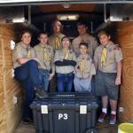 Boy Scouts with Troop 90 in Sequim stand inside the trailer that a thief or thieves broke into sometime last month and took about $900 in camping equipment. (Matthew Nash/Olympic Peninsula News Group)