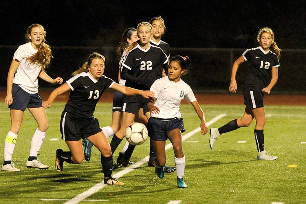 Sequims Natalya James (13) and Ellensburgs Melissa Sanchez battle for the ball in a state 2A playoff game Nov. 7 in Silverdale. (Michael Dashiell/Olympic Peninsula News Group)