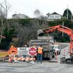 Work continues at the intersection of Quincy and Washington streets in downtown Port Townsend to create new pedestrian crossings that are Americans with Disabilities Act accessible. The work is part of the Jefferson Street Sidewalk Extension project and is expected to be completed in January. (Jeannie McMacken/Peninsula Daily News)