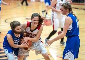 Steve Mullensky/for Peninsula Daily News Chimacums Grace Yaley, 1, and Port Townsends Aurin Asbell, 12, fight for control of the ball as Chimacums Jada Trafton watches during action in a Friday night game in Port Townsend.