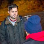 Port Angeles City Manager Nathan West talks with a woman at Veterans Memorial Park on Thursday evening. (Jesse Major/Peninsula Daily News)