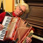 Although Paul is a fabulous keyboard player, my favorite tunes are when he plays his accordion, said Carla Main, singer with the Holiday Hi-Jinx Band. Hi-Jinx 2018 arrives at the Quimper Unitarian Universalist Fellowship hall in Port Townsend this Sunday. (Diane Urbani de la Paz/for Peninsula Daily News)