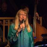Port Townsends Carla Main sings with the Holiday Hi-Jinx Band on Sunday at Port Townsends Quimper Unitarian Universalist Fellowship hall. (Diane Urbani de la Paz/for Peninsula Daily News)