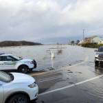 Units from the Clallam County Sheriffs Office and Clallam Fire District No. 3 help residents on a flooded 3 Crabs Road.