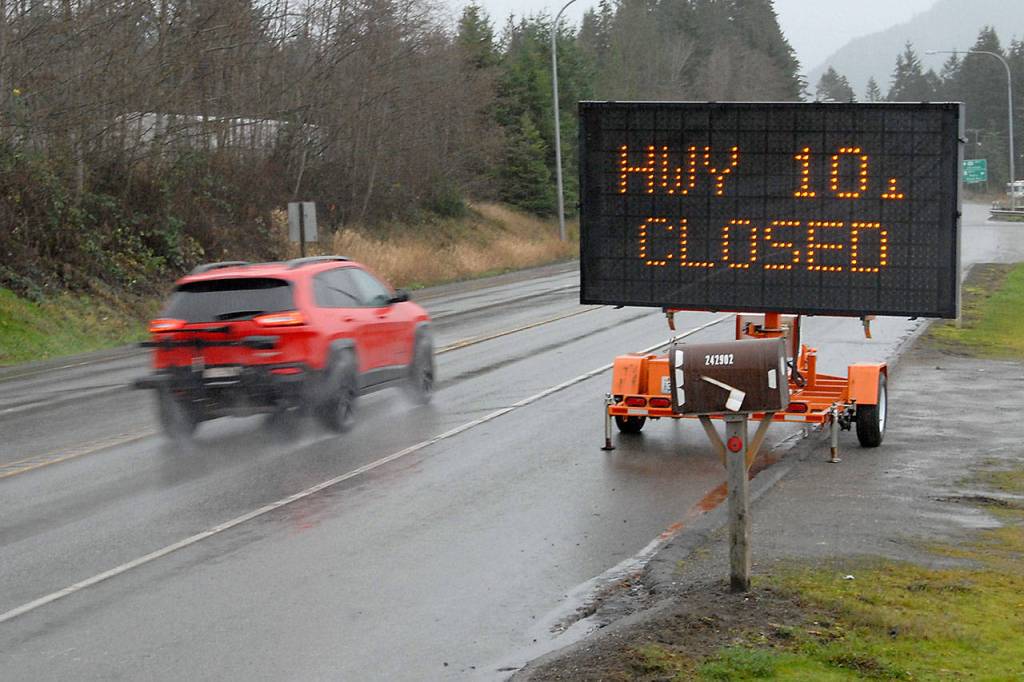 A traffic board at U.S. Highway 101 at Laird Road west of Port Angeles warns motorists of a highway closure ahead at Lake Crescent on Thursday. (Keith Thorpe/Peninsula Daily News)