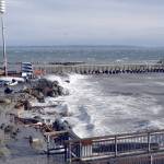 Port Townsends north breakwater was almost underwater and the south breakwater was battered by wind, waves and a high tide Thursday during the height of the storm. The Northwest Maritime Centers beach disappeared under the surf, its rock and log seating almost completely gone, and debris scattered up onto the patio. (Jeannie McMacken/Peninsula Daily News)