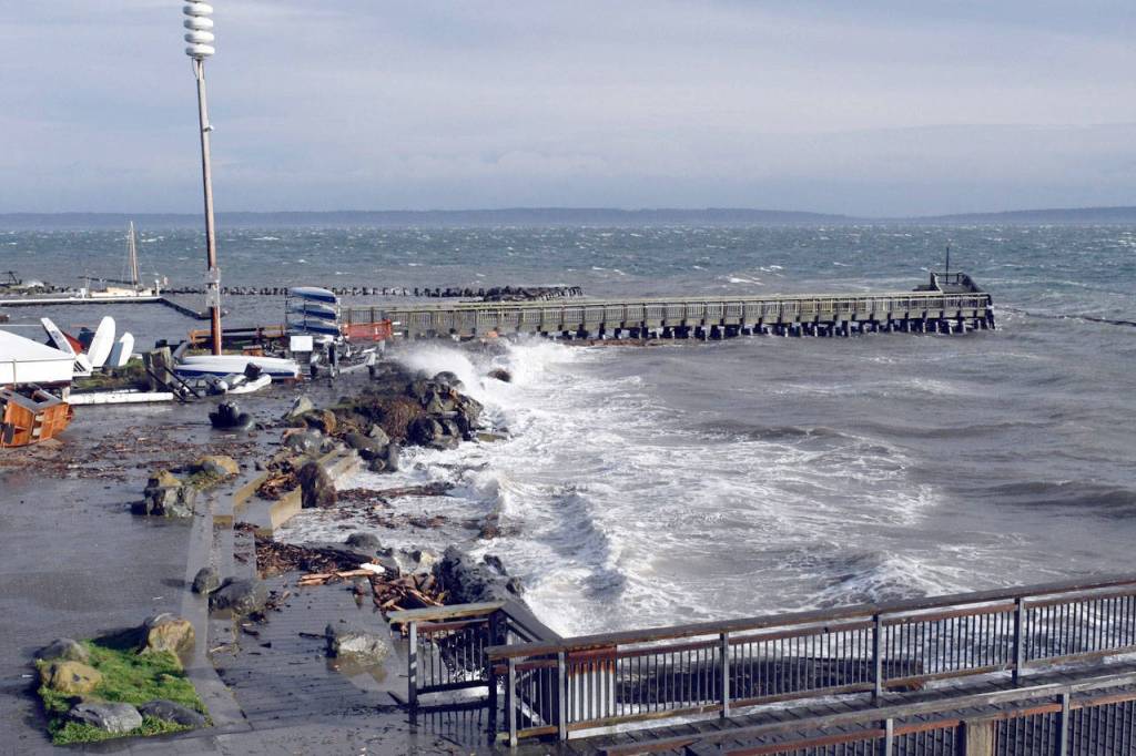 Port Townsends north breakwater was almost underwater and the south breakwater was battered by wind, waves and a high tide Thursday during the height of the storm. The Northwest Maritime Centers beach disappeared under the surf, its rock and log seating almost completely gone, and debris scattered up onto the patio. (Jeannie McMacken/Peninsula Daily News)