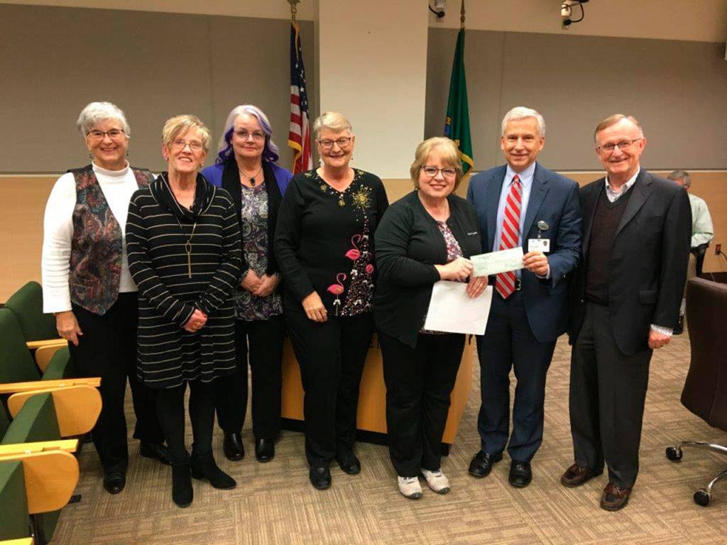 Olympic Medical Center hospital commissioners and OMC Foundation representatives recognize two Sequim groups that have donated funds to further cancer care expansion plans at OMC over recent years. From left, are Sequim residents Judy Kelley and Cheryl Coulter from the Sunland Drive for the Cure Golf Tournament, Joanne Eriksen and Linda Turner from the Sequim Mad Hatters Tea Committee, OMC Foundation Board member Karen Rogers, OMC CEO Eric Lewis and OMC Foundation Executive Director Bruce Skinner.