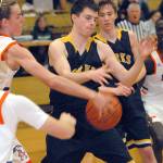 Keith Thorpe/Peninsula Daily News Forks Brandon Baar, center, has the ball stripped away by Auburn-Mountainviews Brandon Miguel on Friday night at Port Angeles High School. Looking on at right is Baars teammate Seth Johnson.
