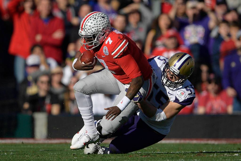 Ohio State quarterback Dwayne Haskins gets sacked by Washington linebacker Ryan Bowman during the first half of the Rose Bowl NCAA college football game Tuesday, Jan. 1, 2019, in Pasadena, Calif. (AP Photo/Mark J. Terrill)