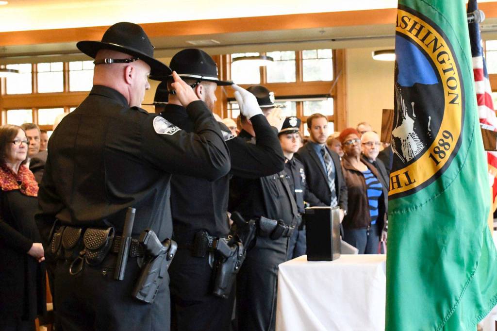 Members of the Port Townsend Police Department honored Reserve Sergeant Dave Winegar at his memorial service Friday at Fort Worden. Winegar was remembered as a man who wore his badge proudly and, according to Chief Michael Evans, was a warrior. (Jeannie McMacken/Peninsula Daily News)