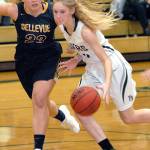 Keith Thorpe/Peninsula Daily News Port Angeles Millie Long, right slips past the defense of Bellevues Sara Bower in the first quarter of their Friday afternoon matchup at Port Angeles High School.