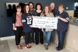 PHOTO: Food, funds donation banked in Port Angeles