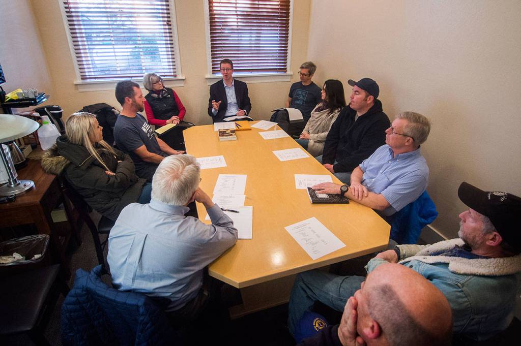 In back center, U.S. Rep. Derek Kilmer, D-Gig Harbor, meets with members of the Hurricane Ridge Winter Sports Club, which has been unable to open the Hurricane Ridge Ski and Snowboard Area due to the partial federal shutdown. (Jesse Major/Peninsula Daily News)