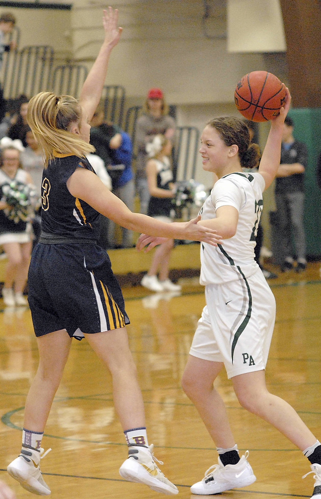 <strong>Keith Thorpe</strong>/Peninsula Daily News                                Port Angeles Madison Cooke, right, looks to pass over the defense of Bellevues Montana Jones.